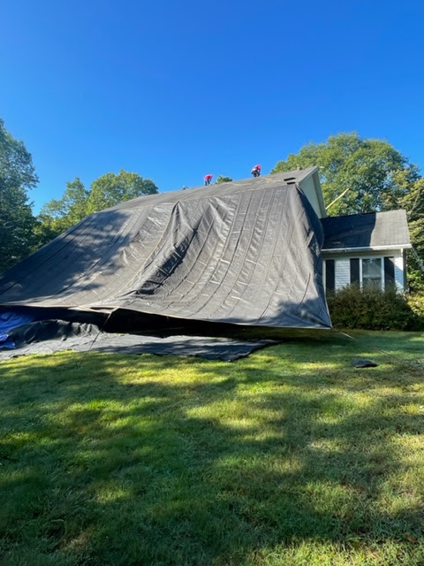 House with Tarp Covering It